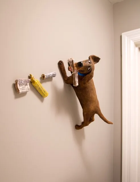 Wall Dog with Newspapers — ceramic and mixed-media sculpture by Steve Jones