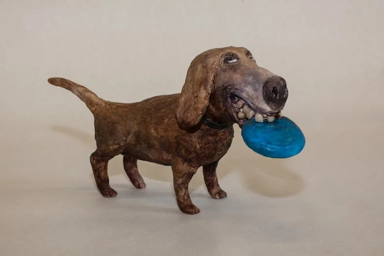 Frisbee Dog — ceramic and mixed-media sculpture by Steve Jones