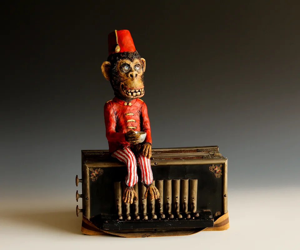 Monkey on Accordion — ceramic and mixed-media sculpture by Steve Jones
